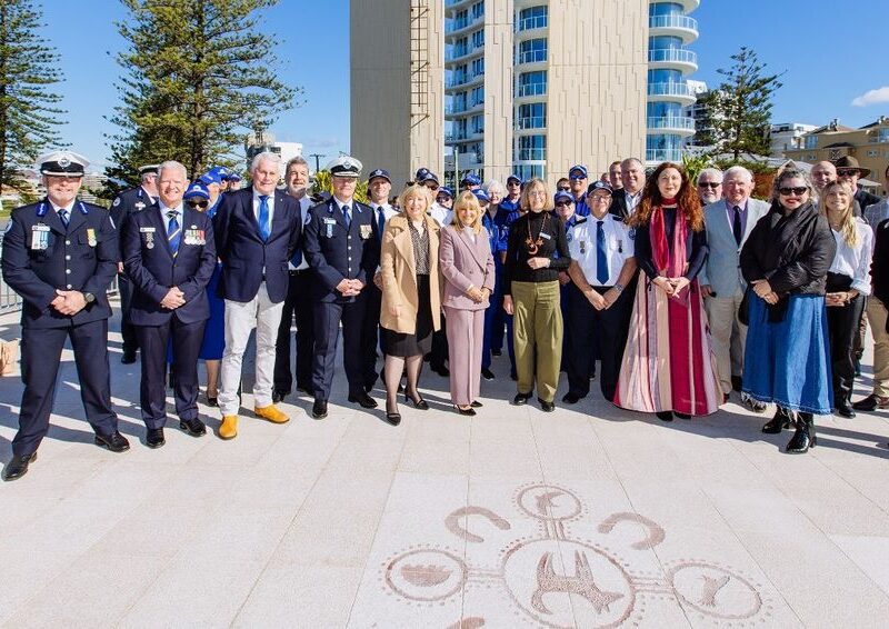 Tweed Shire Council's image of project team standing in front of the newly refurbished Captain Cook Memorial and Lighthouse at Tweed Heads.