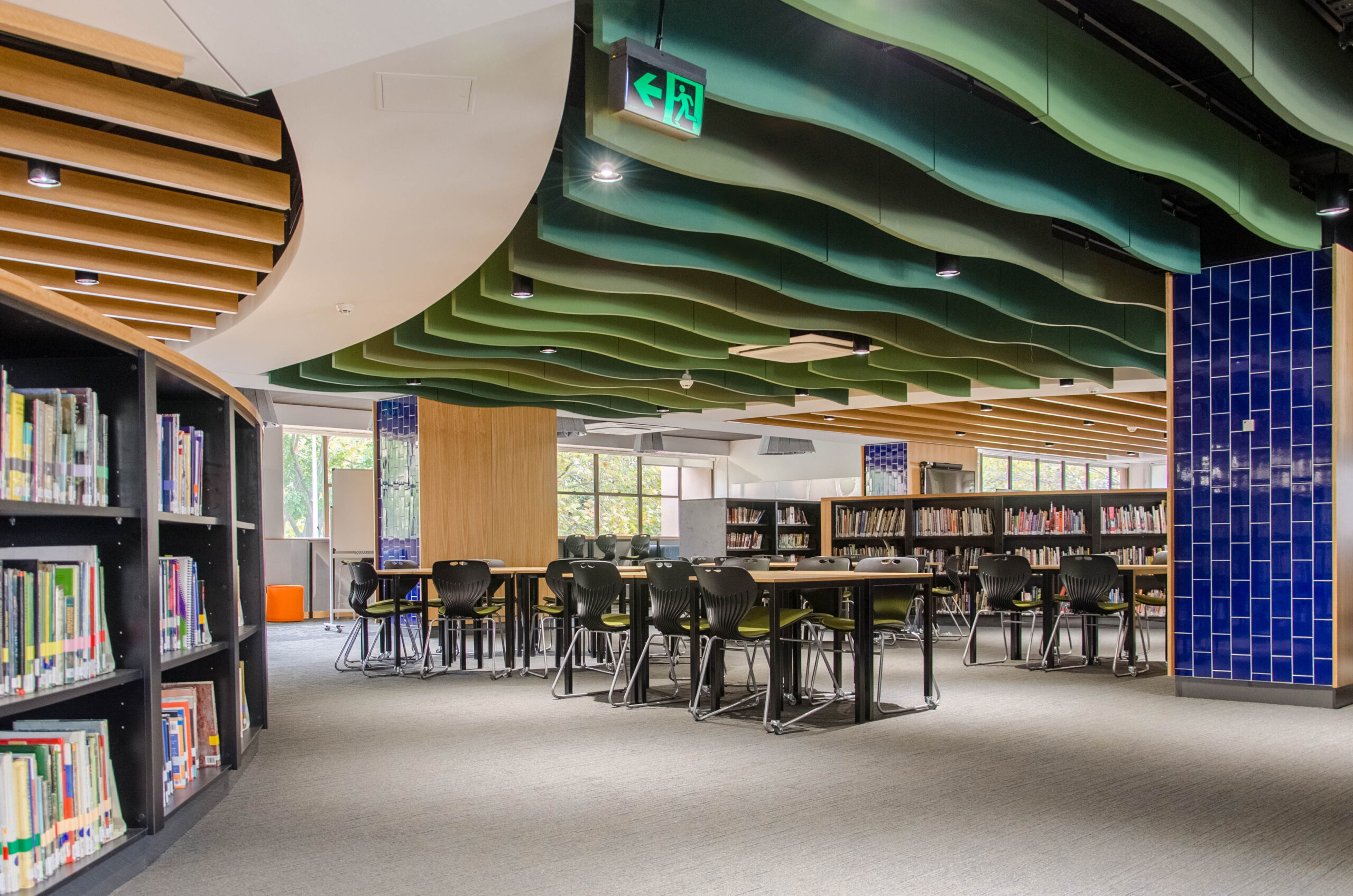 Interiors of St Marys Cathedral College with green ceiling and blue tiled feature wall.
